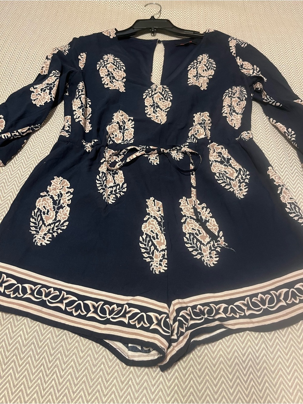 Xtaren Navy Shorts Romper with Cream Floral Accents & Drawstring Waist. NWOT.
